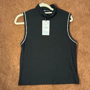 NWT woman’s Zara Vest in black with stoned arm openings. Size L.